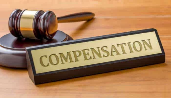 From off-road trails to city highways accident claims across nevada 1 | tycoonstory media Gavel and a 'compensation' sign on a wooden desk, symbolizing legal compensation decisions.
