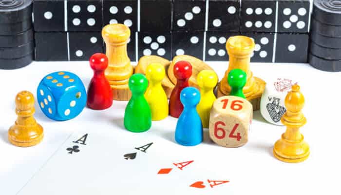Why mini-games matter | tycoonstory media Free bitcoin games concept shown through colorful board game pieces and dice representing strategy, chance, and progression in crypto-themed gaming environments.