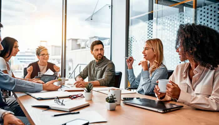 Business law in an expanding economy | tycoonstory media New braunfels and seguin business professionals discussing legal strategies and business decisions during a meeting focused on business law and growth.