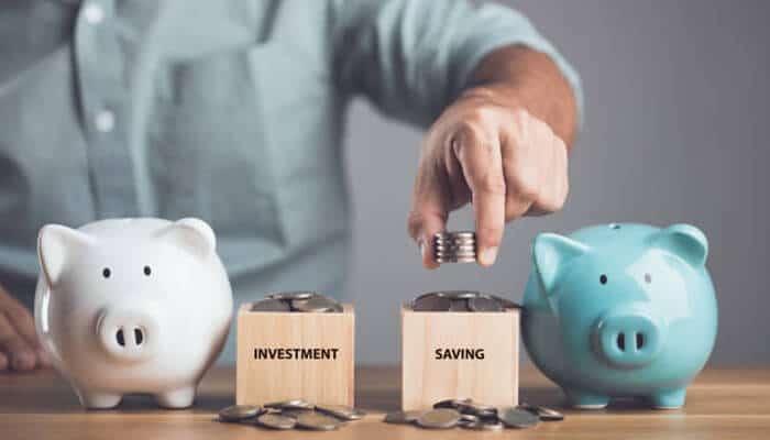 Introducing the importance of investing and saving | tycoonstory media Financial literacy concept demonstrating the importance of investing and saving, with coins being placed into piggy banks and labeled savings and investment containers to teach long-term wealth-building habits.