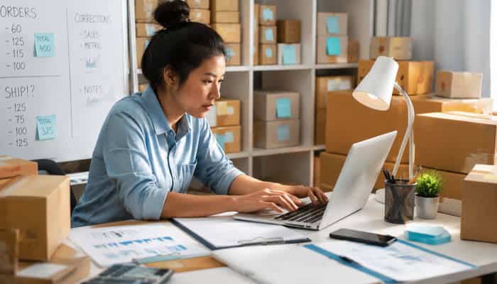 Is dropshipping passive income? Entrepreneur managing product orders, supplier operations, and ecommerce tasks from a home-based dropshipping workspace.