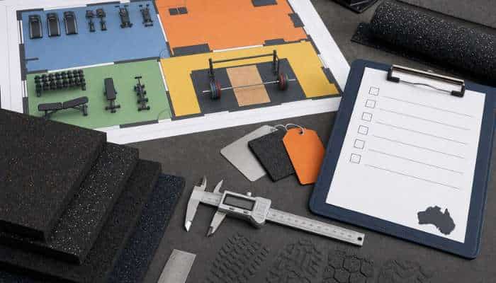 How to choose the best rubber gym flooring in australia 2 | tycoonstory media Color-coded gym layout plan with a weights diagram, foam mat samples, color swatches, a clipboard checklist, and calipers for planning a fitness space.