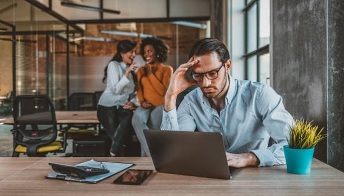Untitled-1 | tycoonstory media Employee experiencing stress in a workplace setting related to workplace harassment concerns and professional challenges
