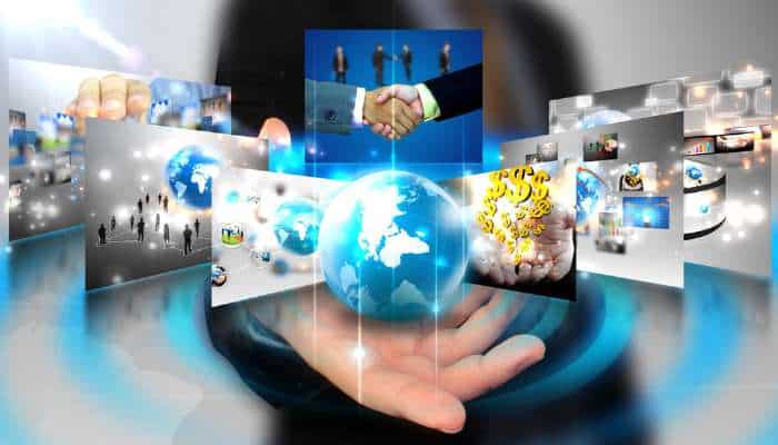 Why turkey keeps showing up on european tech companies nearshoring shortlists 1 | tycoonstory media Hands cradle a glowing globe with floating screens depicting global business and technology networks.