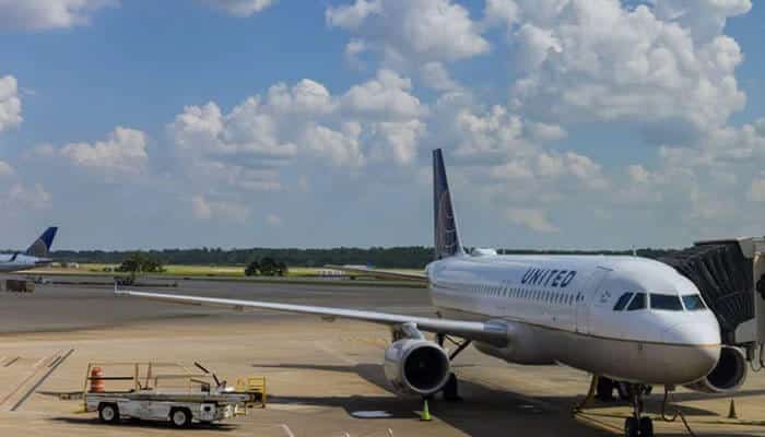 Fleet shifts that change what you will fly - tycoonstory | tycoonstory media Airline route, fleet, and industry changes represented by a united aircraft at an airport gate, showing modern fleet operations, airline capacity adjustments, and changing travel schedules.