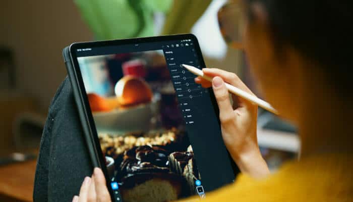 Can you use veed io on iphone and android - tycoonstory | tycoonstory media Veed io mobile video editing on a tablet, illustrating how creators can edit visual content and manage digital media using veed io tools on mobile devices.