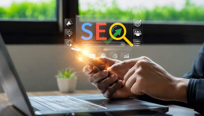The seo benefits of digital branding aggr8tech - tycoonstory | tycoonstory media Digital branding aggr8tech seo strategy shown with a marketer using mobile and laptop tools to improve search visibility and engagement.