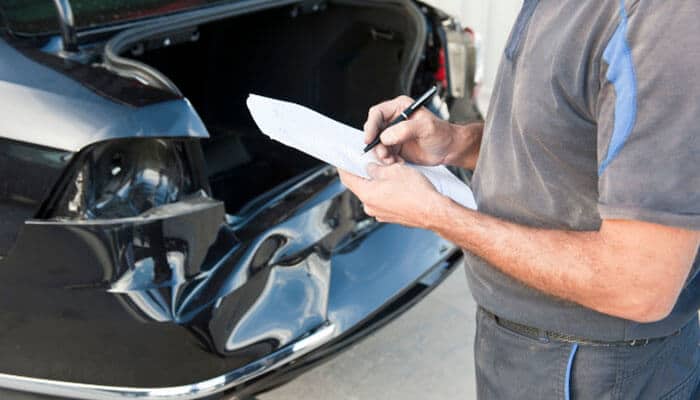 Describe the vehicle accurately - tycoonstory | tycoonstory media 0 cash for junk cars without title vehicle inspection showing a damaged car being assessed and documented before a junk car sale or pickup.