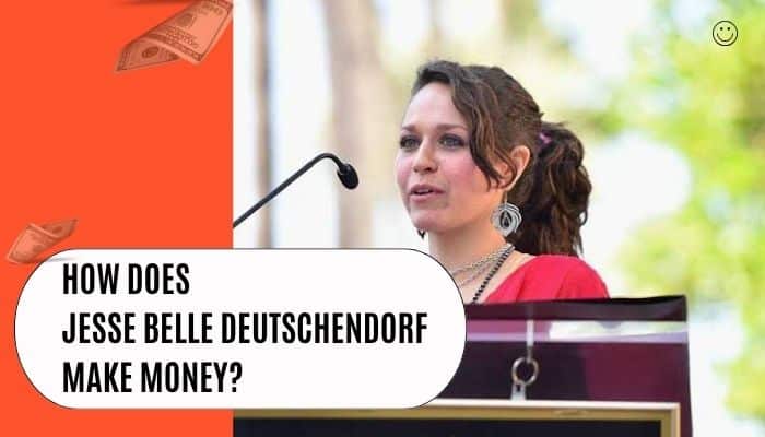 Jesse belle deutschendorf - tycoonstory | tycoonstory media Jesse belle deutschendorf speaking at a podium in a featured image exploring how she makes money and her professional background.
