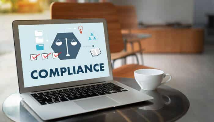 Practical compliance framework - tycoonstory | tycoonstory media Laptop displaying a compliance checklist illustrating constraint on bavayllo, with policy review, content restrictions, disclosures, and pre-publication checks.