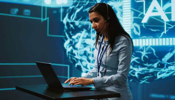The future of tech guru wavetechglobal - tycoonstory | tycoonstory media Tech guru wavetechglobal professional using a laptop in an ai-powered workspace with digital brain graphics, representing artificial intelligence and emerging technology.