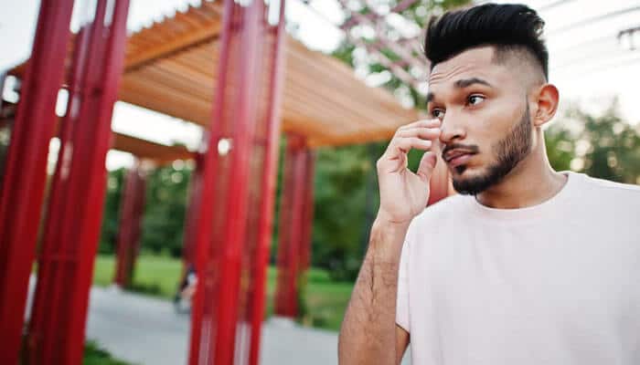 Thick hair - tycoonstory | tycoonstory media Low taper fade with textured fringe on thick dark hair, featuring clean tapered sides, natural volume on top, and a sharp modern men’s hairstyle.
