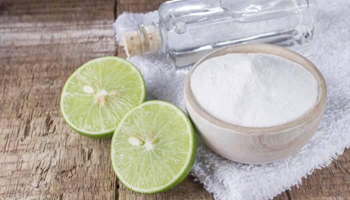 Supports industry-specific requirements - tycoonstory | tycoonstory media Two lime halves, a bowl of salt, and a salt shaker on a rustic wooden surface.
