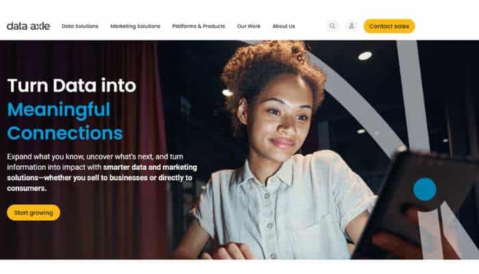 7 best manufacturing email list providers for b2b outreach in 2026 1 | tycoonstory media Hero banner showing a woman using a tablet in a dark, modern studio, with the headline 'turn data into meaningful connections' and a yellow call-to-action button, conveying a data solutions theme.