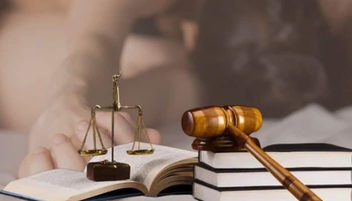 Are private consensual acts between adults illegal - tycoonstory | tycoonstory media Lewd acts meaning illustrated with a judge’s gavel, law books, and scales of justice, representing legal definitions, public conduct laws, and court considerations.