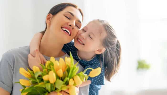 French terms of endearment for children - tycoonstory | tycoonstory media French terms of endearment for children showing a loving mother and child sharing affection, representing cute french expressions like mon petit cœur, ma puce, mon ange, and mon trésor used for family bonding and love.