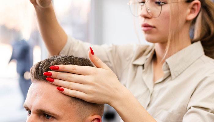 How to style mens medium length hairstyles - tycoonstory | tycoonstory media Mens medium length hairstyles styling session showing a professional applying and shaping hair product on a modern medium-length haircut, highlighting textured layers, volume control, and grooming techniques for a polished masculine look.