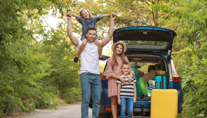 Is the kia telluride 2027 good for families - tycoonstory | tycoonstory media Kia telluride 2027 family road-trip scene with parents and children beside a packed suv, highlighting the three-row telluride’s family-focused seating and cargo versatility.