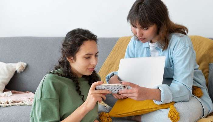 Is there an instapv age requirement - tycoonstory | tycoonstory media Instapv age requirement guide showing two young users using a smartphone and laptop while exploring age and parental-permission requirements for the instapv platform