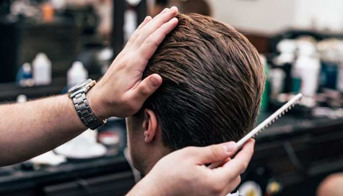 Medium shag haircut - tycoonstory | tycoonstory media Mens medium length hairstyles styling process showing a barber shaping and refining a textured medium-length haircut with layered volume, natural movement, and modern grooming techniques for men.