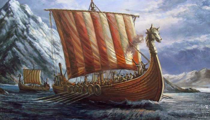 Real-money online casino games 2 | tycoonstory media Viking longship with a dragon head prow sailing in rough seas by snowy mountains, striped red-and-cream sail extended, rowers aboard