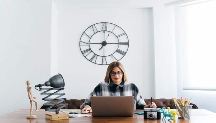 What does 555 mean for career and work - tycoonstory | tycoonstory media What does 555 mean for career and work, showing a professional woman planning goals at a desk with a laptop, representing personal growth, career transformation, new opportunities, and positive changes