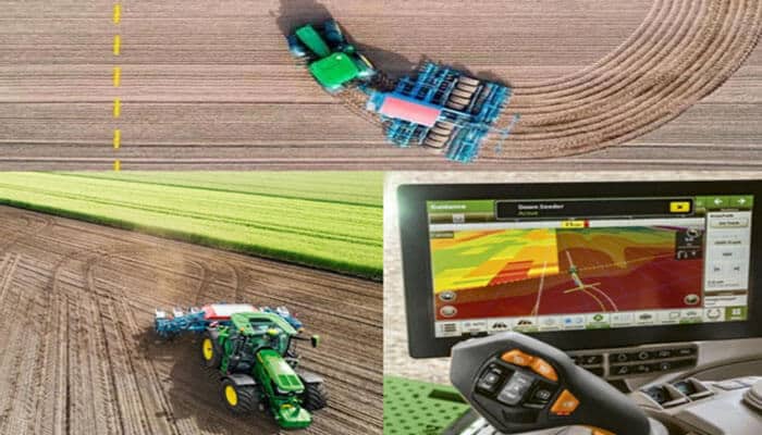 Picture shown: john deere autotrac | tycoonstory media Aerial view of a farm field with two green tractors and a colorful gps map displayed on a tractor monitor for precision farming.