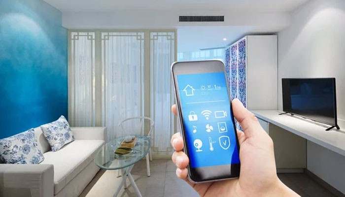 Artificial intelligence and predictive automation - tycoonstory | tycoonstory media Techoelite smart homes smartphone dashboard showing automated lighting, climate, security, and connected device controls in a modern living room.