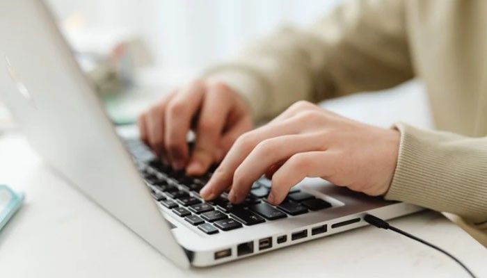 Better productivity - tycoonstory | tycoonstory media Software techoelite concept showing a professional using a laptop for digital workflows, productivity, software management, and technology-driven business tasks