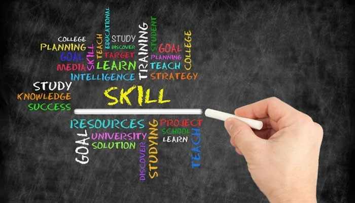 Build skills beyond the classroom | tycoonstory media Hand holding chalk under a chalkboard graphic with the word 'skill' in yellow and related colorful words like study, learning, goals, resources, strategy, planning, and education around it.