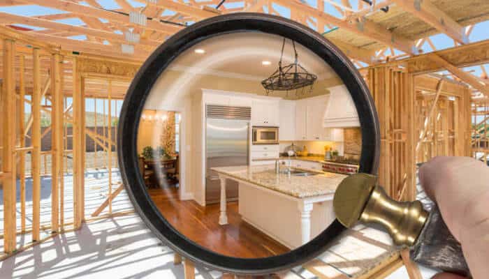 New construction shows how far the search side has expanded | tycoonstory media Magnifying glass focusing on a white kitchen with an island inside a wooden-framed new-house under construction