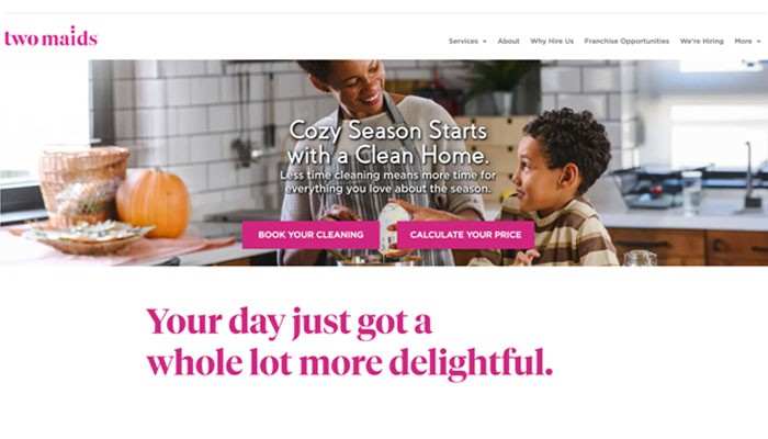 Two maids (clinton township) | tycoonstory media Hero banner showing two cleaners in a bright kitchen with pumpkins; overlay text promotes a clean home and includes pink call-to-action buttons 'book your cleaning' and 'calculate your price'.