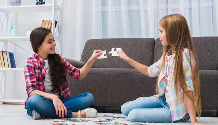 Memory game for adults - tycoonstory | tycoonstory media Memory game activity with two young players matching puzzle-shaped cards, encouraging visual recall, concentration, attention, and pattern recognition.