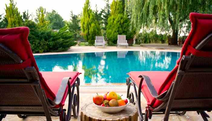 Pools trampolines and higher-risk property features - tycoonstory | tycoonstory media House insurance company allstate coverage considerations for a backyard swimming pool, highlighting property protection and liability risks associated with higher-risk home features.