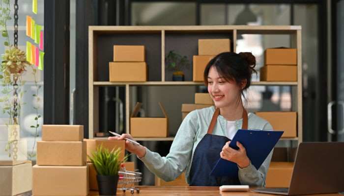 Shopify startup pivot - tycoonstory | tycoonstory media Startup pivot in an e-commerce business, showing an entrepreneur reviewing inventory and customer orders while assessing product demand, operations, and opportunities to change the business model based on market feedback.