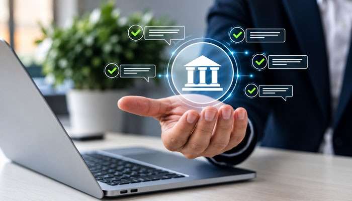 The address that banks look at | tycoonstory media Hand supporting a glowing bank icon above a laptop, with green checkmarks and chat bubbles signaling secure online banking and compliance.