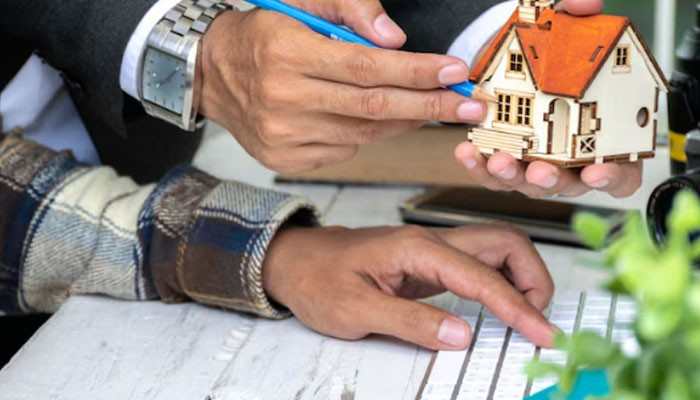 What is portability - tycoonstory | tycoonstory media Miami dade property search concept showing homeowners reviewing property documents and a model house while researching homestead exemption, assessed value, and portability benefits.