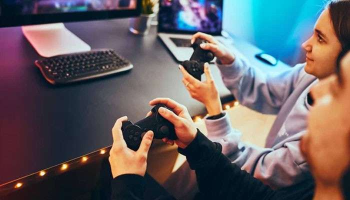 Xbox cloud gaming play games without a console - tycoonstory | tycoonstory media Microsoft xbox gaming experience featuring two players using wireless controllers while enjoying video games on connected screens.
